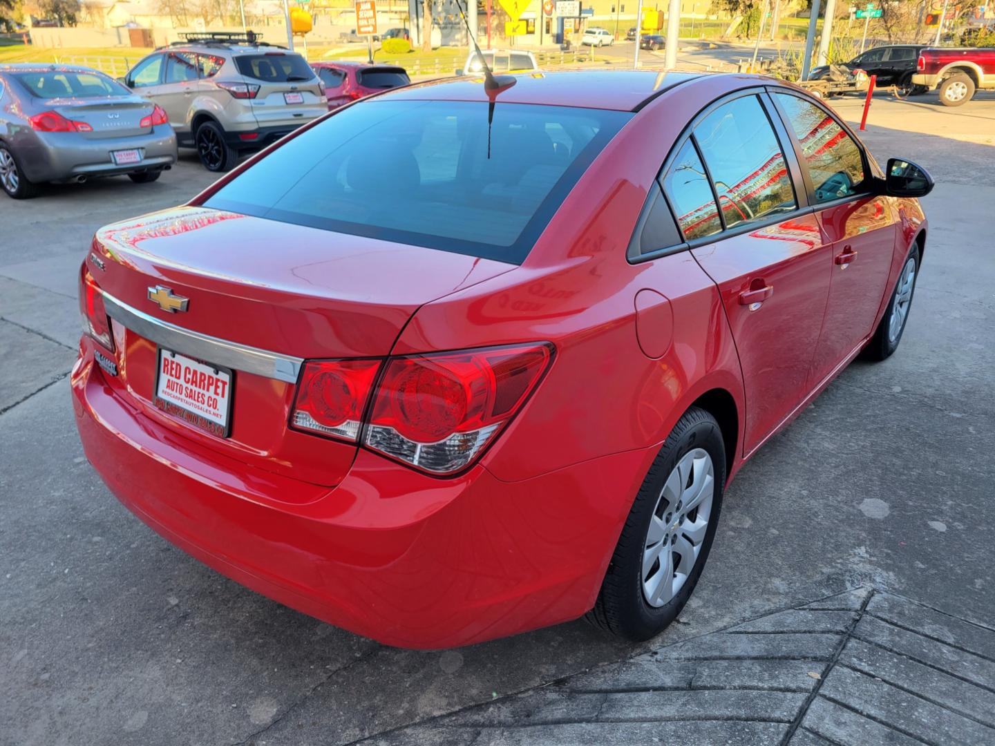 2014 Red Chevrolet Cruze LS Auto (1G1PA5SH8E7) with an 1.8L L4 DOHC 16V FFV engine, 6-Speed Automatic transmission, located at 503 West Court, Seguin, TX, 78155, (830) 379-3373, 29.568621, -97.969803 - Photo#2